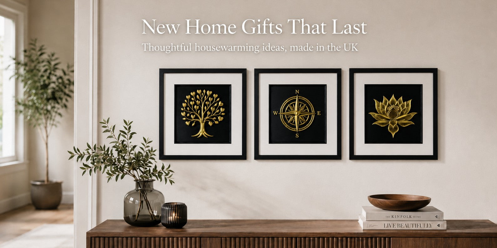 New home gifts blog hero image showing framed gold leaf wall art with tree of life, compass and lotus designs in a calm home interior.