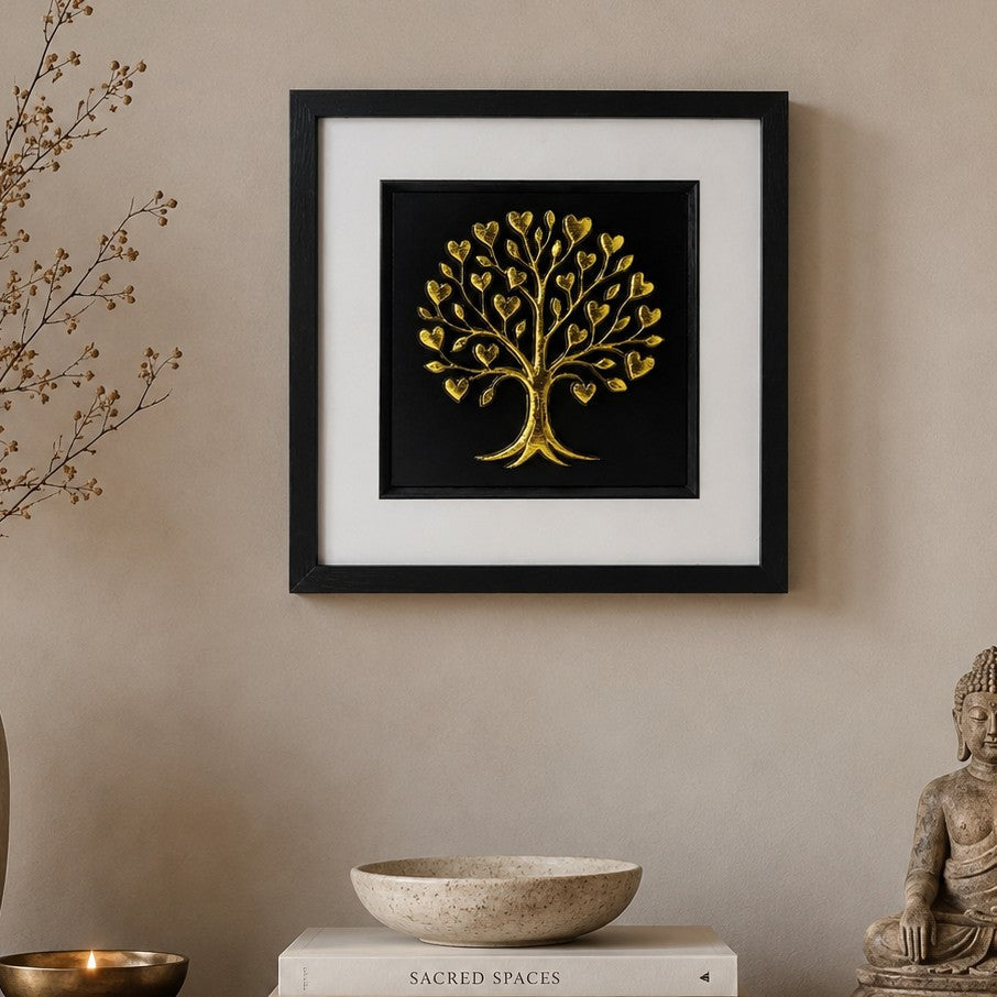 Gold Tree of Life wall art in a black frame with white mount, styled in a peaceful neutral home interior for spiritual and symbolic decor.