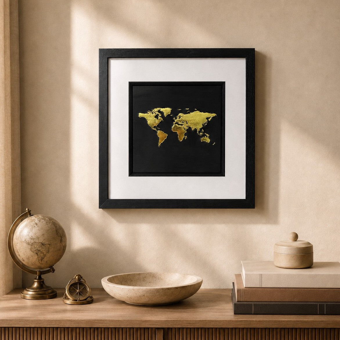 Framed gold world map 3D wall art with black background and white mount, styled in a warm neutral travel-inspired interior.