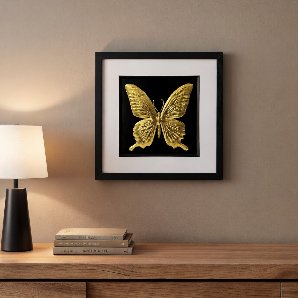 Gold framed 3D butterfly wall art on a neutral living room wall