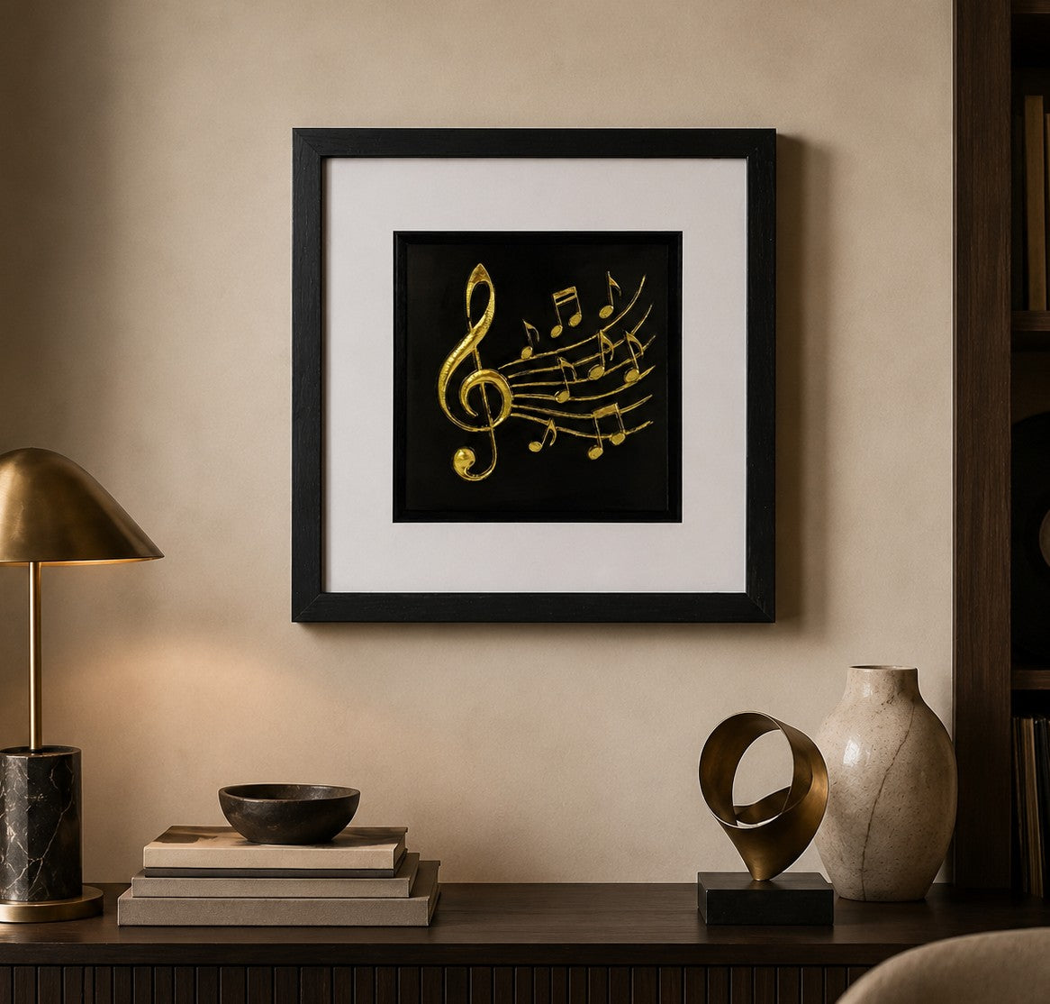 Framed gold treble clef and music notes wall art on a black background, styled in a warm creative interior for unique home decor.