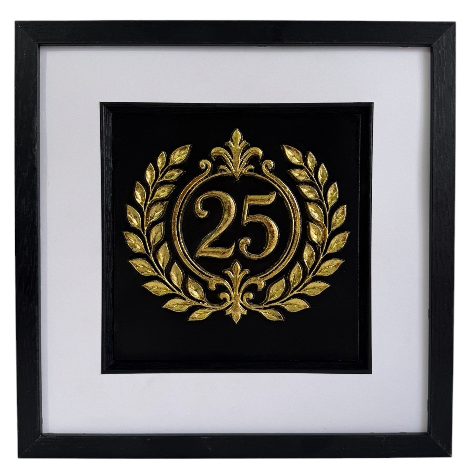 Straight-on Gold 25th anniversary laurel wreath framed artwork with raised number 25, black background, white mount, and black frame.