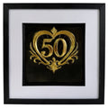 Straight-on Gold 50th anniversary heart framed artwork with raised number 50, ornate heart detail, black background, white mount, and black frame.