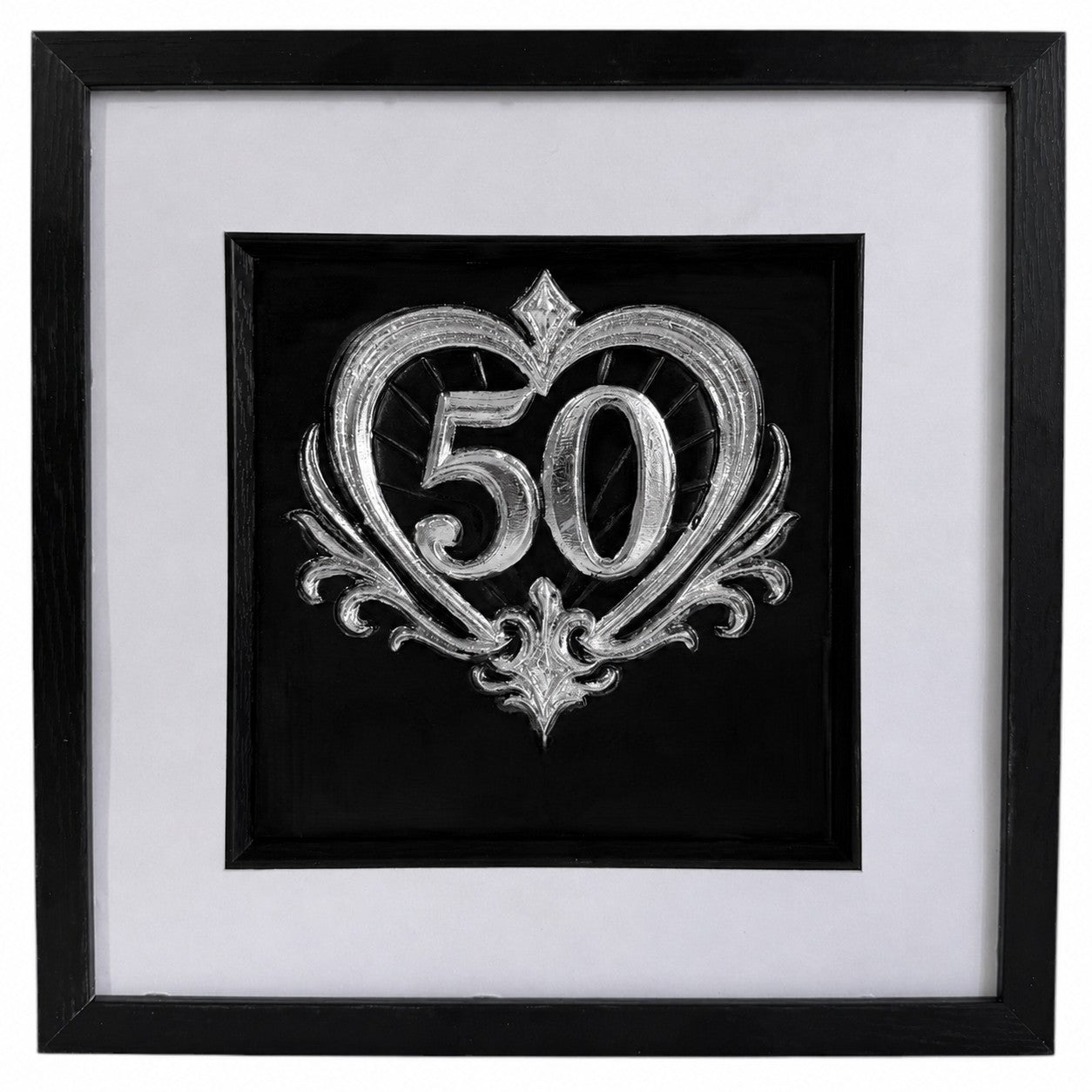 Silver framed 50th anniversary heart artwork with raised number 50, ornate scroll detail, white mount, black background, and black box frame.