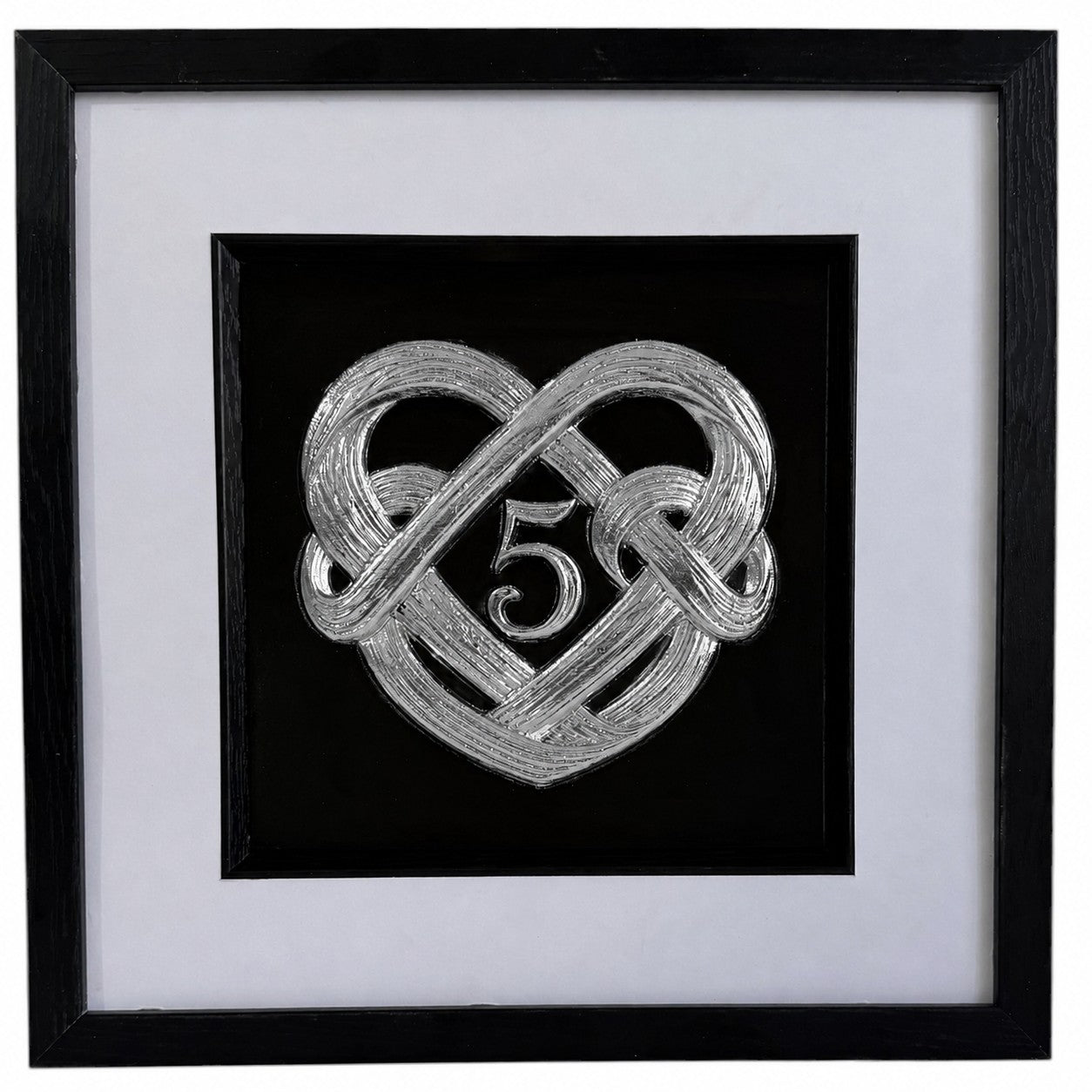 Silver framed 5th wedding anniversary heart knot artwork with raised number 5 design, white mount, and black box frame.