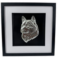Framed Akita wall art in silver leaf featuring a detailed Akita dog head relief on a black background with white mount and black frame