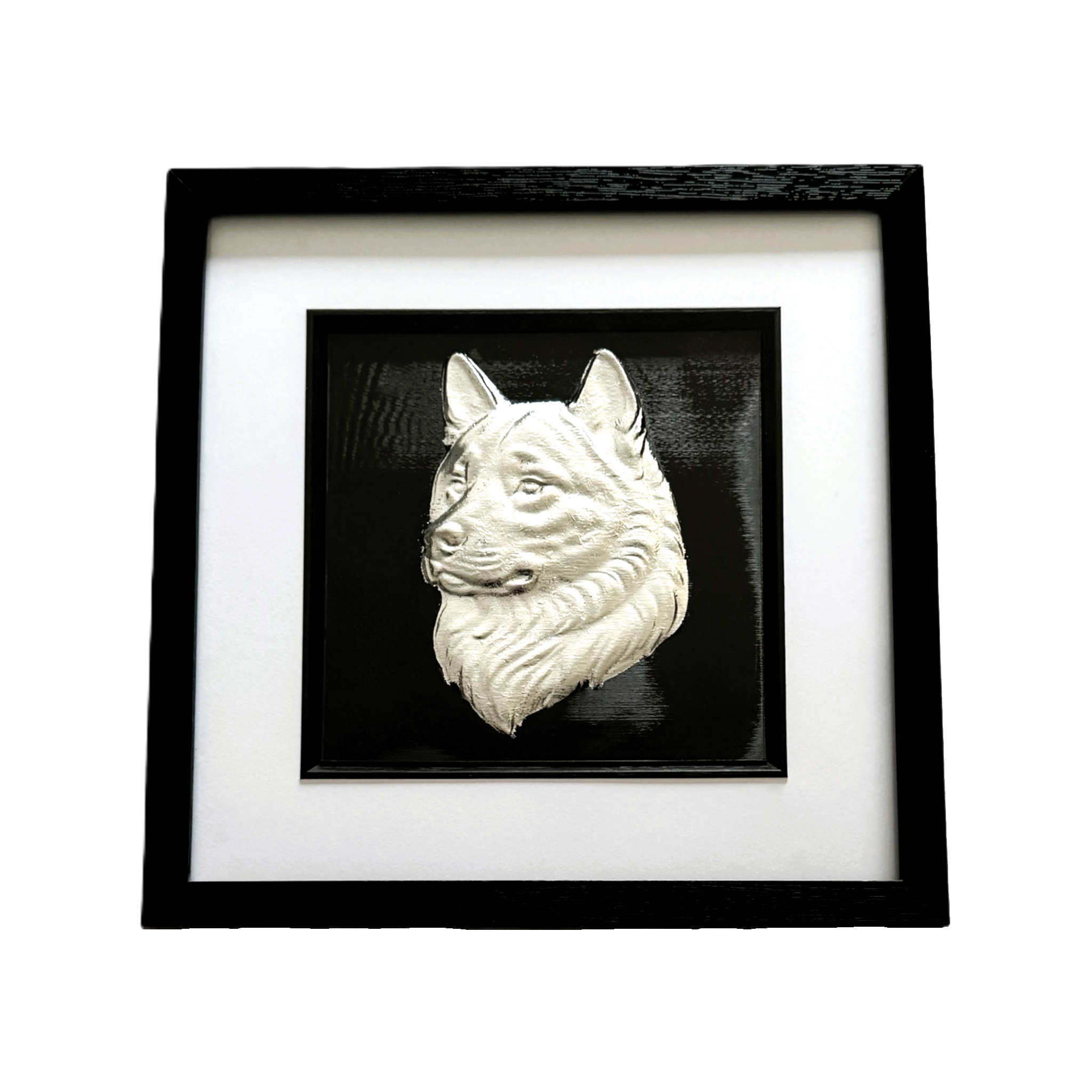 Framed Akita wall art in silver leaf featuring a detailed Akita dog head relief on a black background with white mount and black frame
