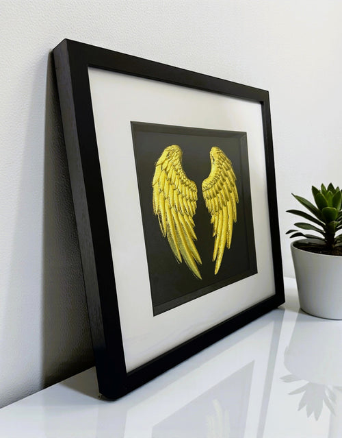 Symbolic angel wings framed wall art for remembrance and reflection