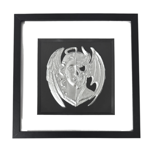 Angel and demon face wall art framed in black with silver leaf relief