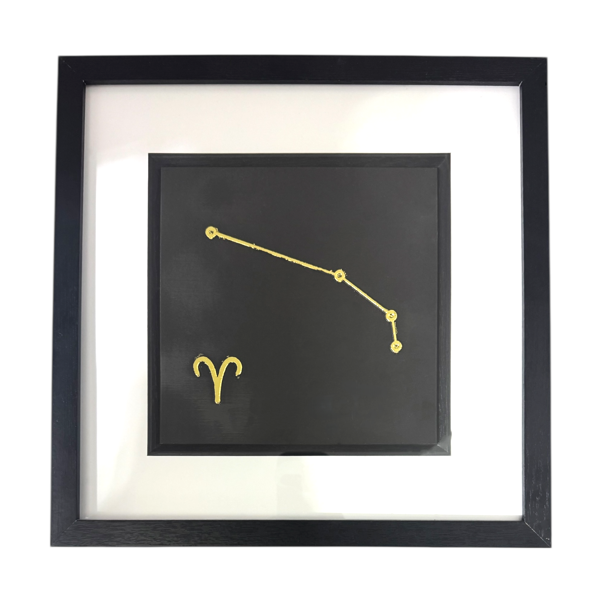 Framed Aries constellation wall art in gold leaf with star pattern and zodiac symbol, centred on a black background with white mount and black frame