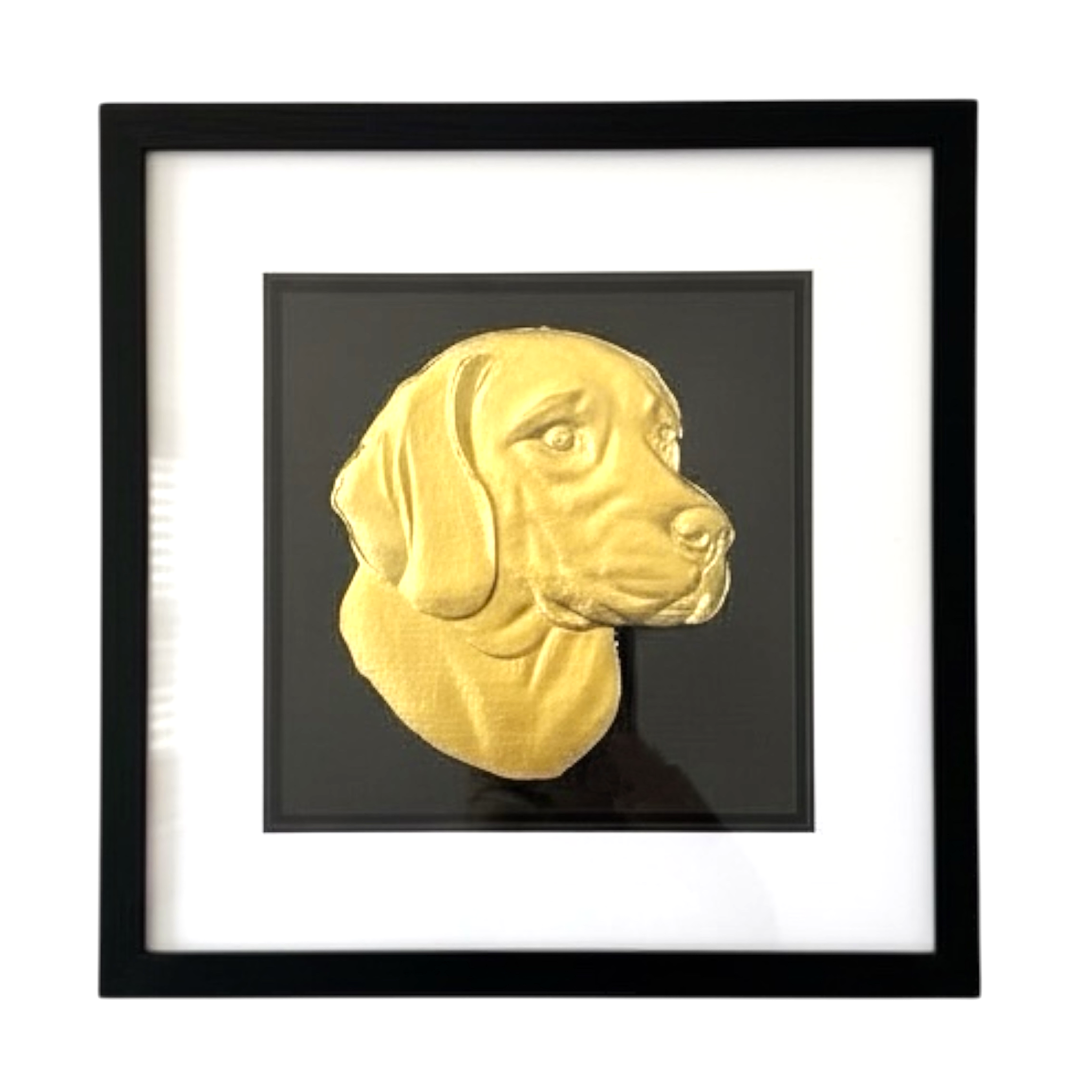 Framed beagle wall art with gold relief portrait on a black background, presented in a black frame with white mount on a clean white background