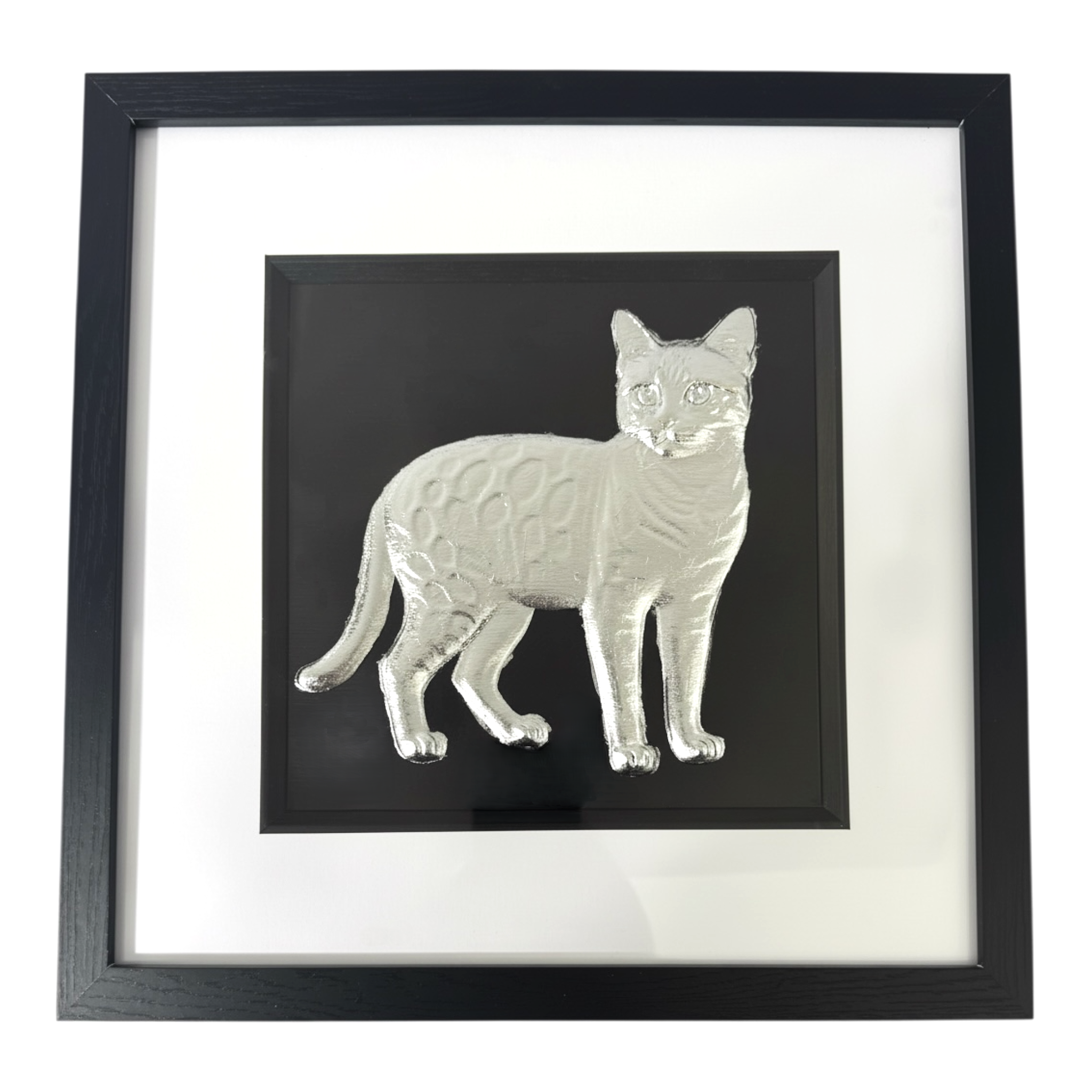 Bengal cat framed wall art in silver leaf with black frame, white mount, and black background