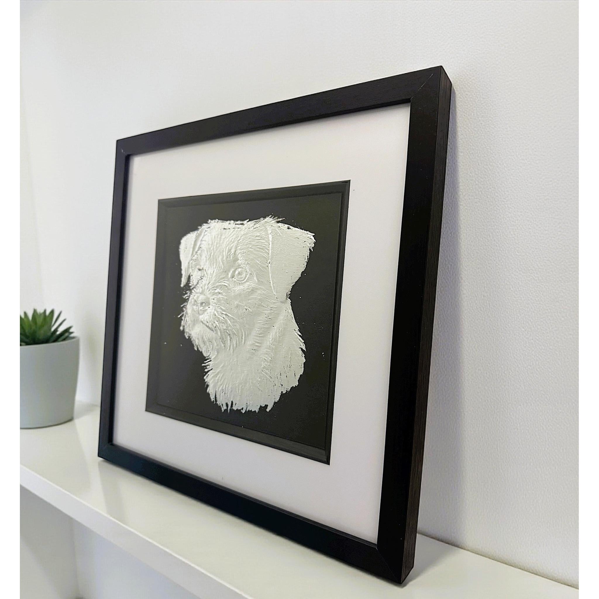 Border Terrier framed wall art displayed on a modern surface setting