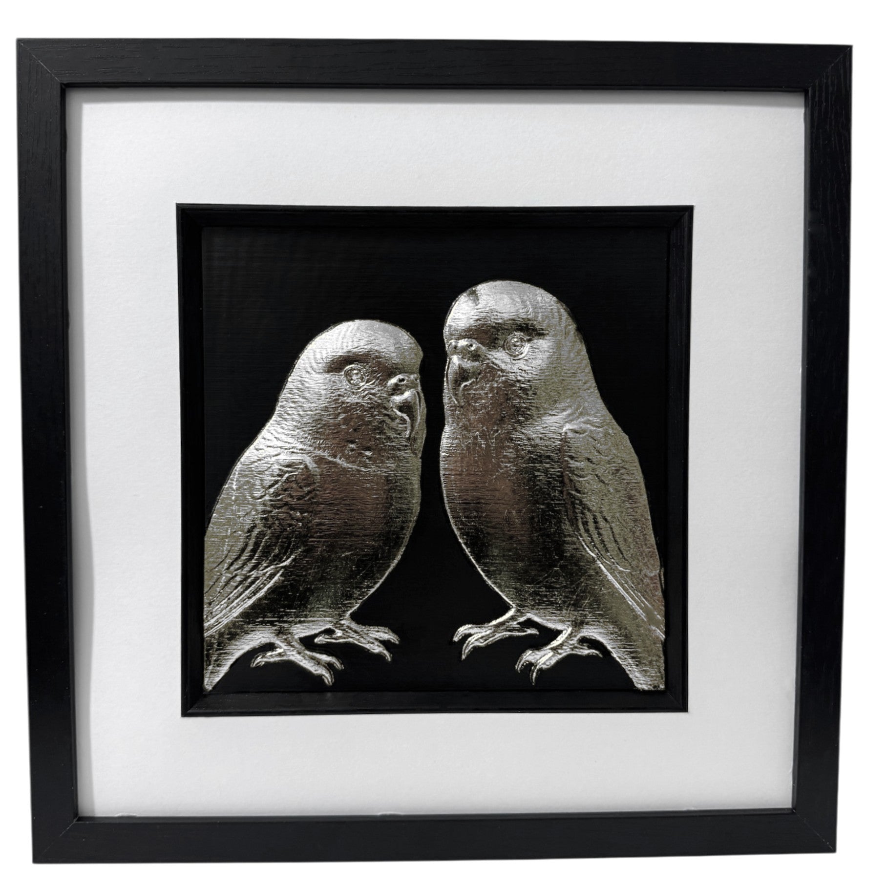 Front view of silver leaf budgie pair relief artwork on black background in a black box frame with white mount