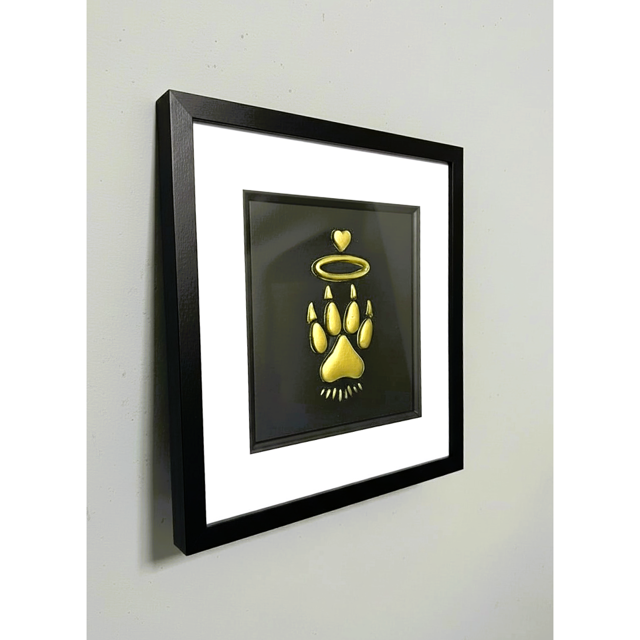Cat Paw Halo framed wall art displayed on wall in black frame with white mount