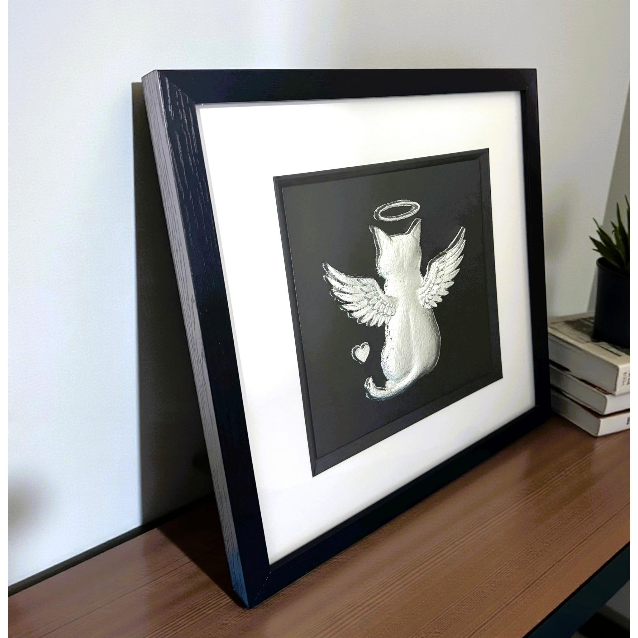 Angled close view of angel cat memorial framed wall art showing wings, halo, and heart detail