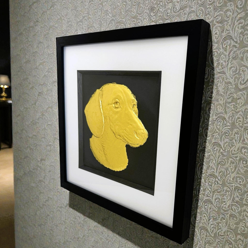 gold leaf dachshund picture angle view on light grey textured wall