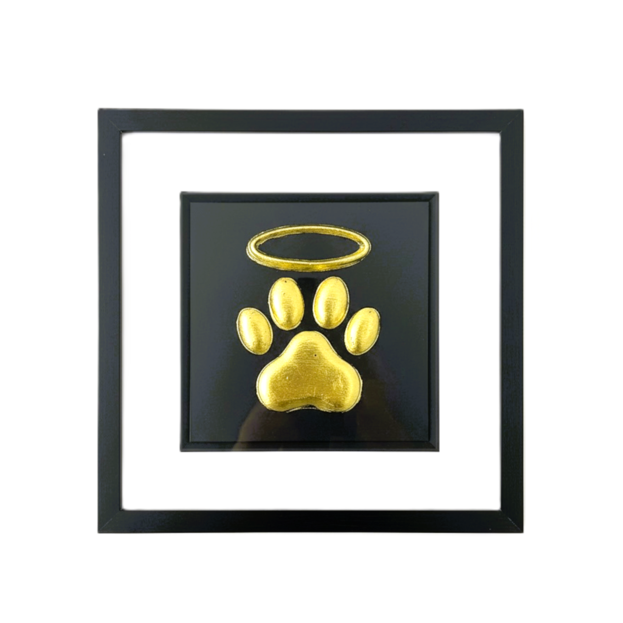 Framed dog paw print with halo memorial wall art in gold leaf on black background
