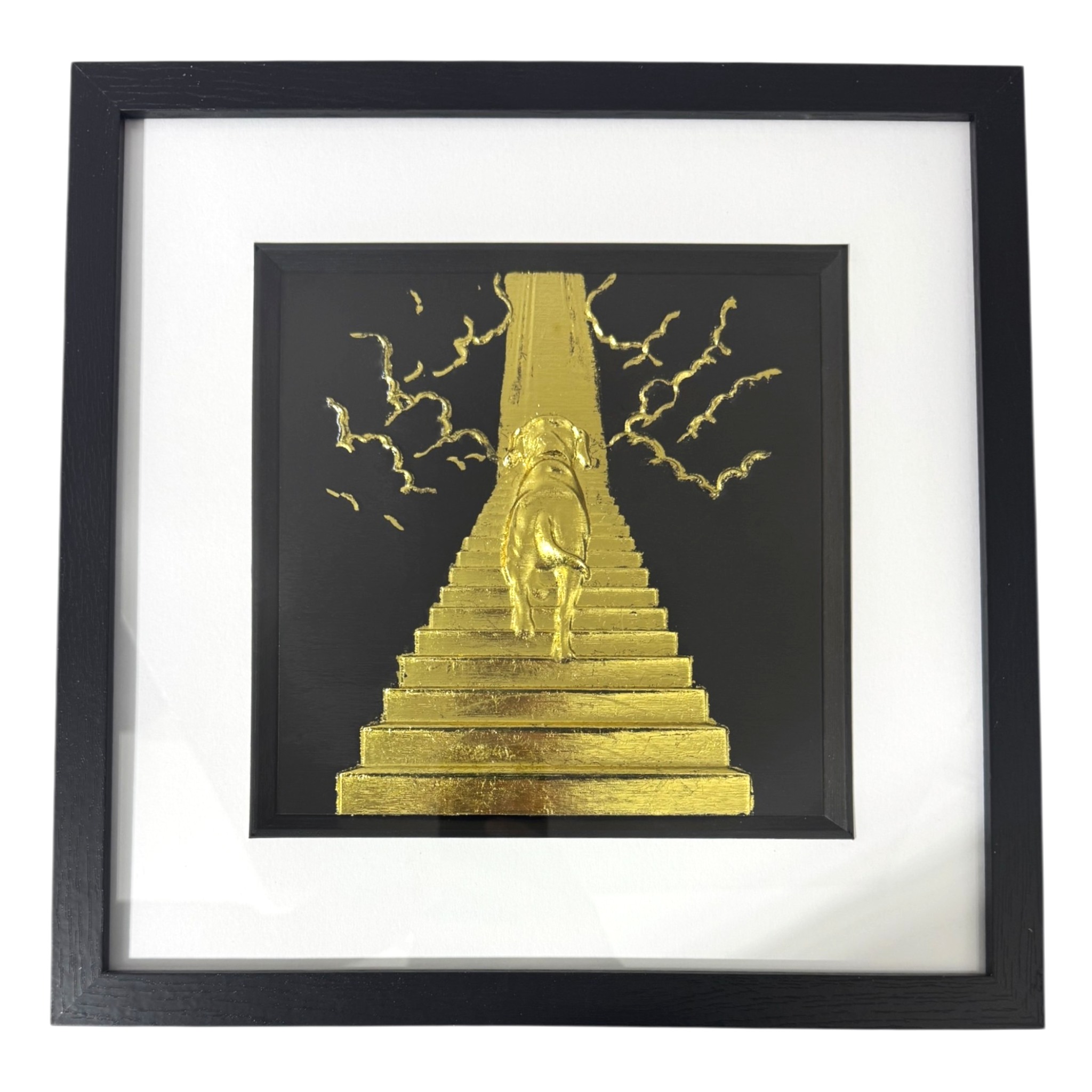 Front view of Dog Stairway to Heaven gold leaf framed wall art in black frame white mount