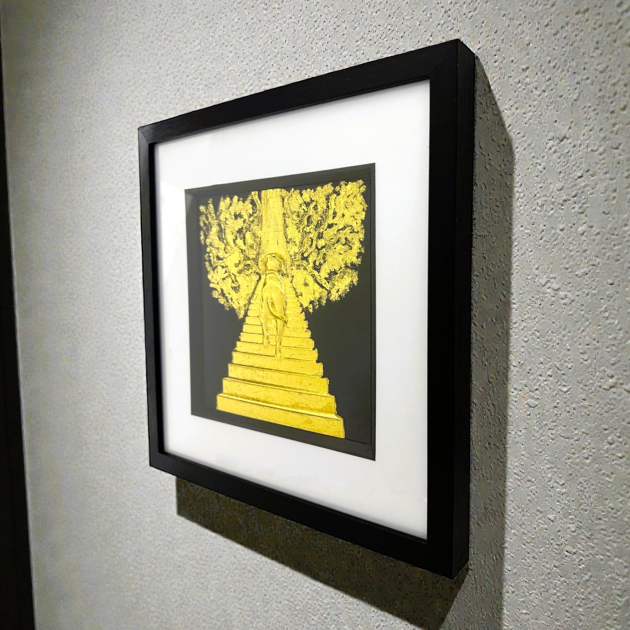 Dog Stairway to Heaven gold leaf wall art displayed on wall with black frame and white mount