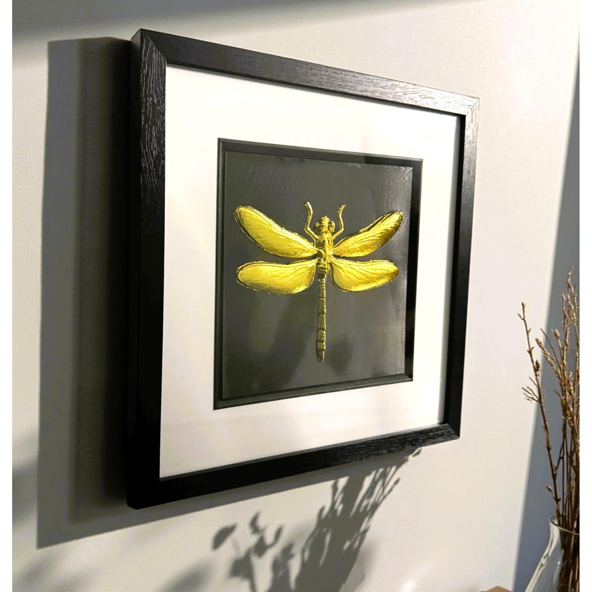 Angled wall-mounted view of dragonfly wall art showing frame depth