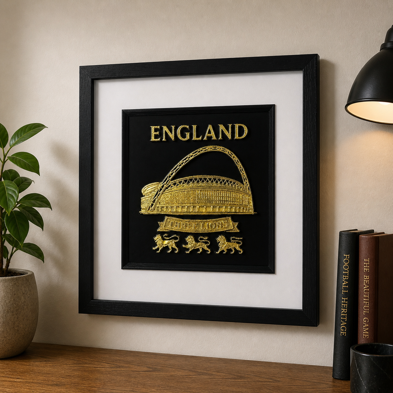 Lifestyle photo of England football wall art displayed on a wall above a wooden sideboard with football themed books.