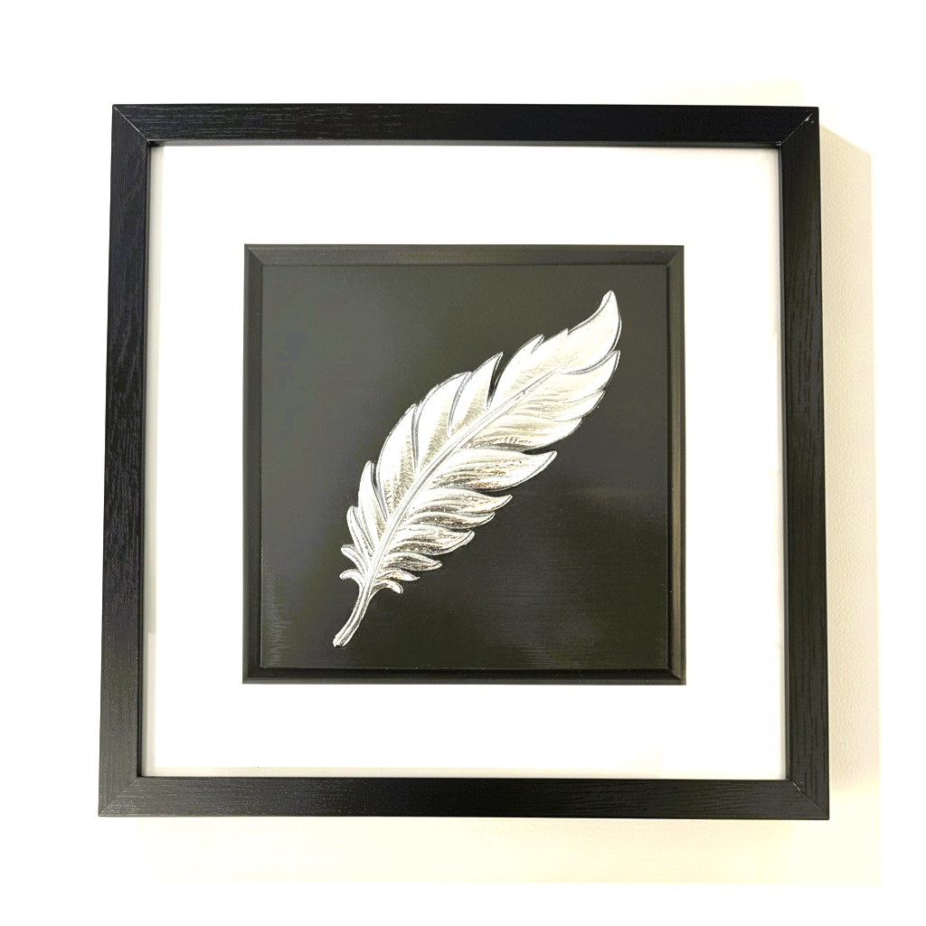 Silver leaf floating feather wall art in black wooden frame