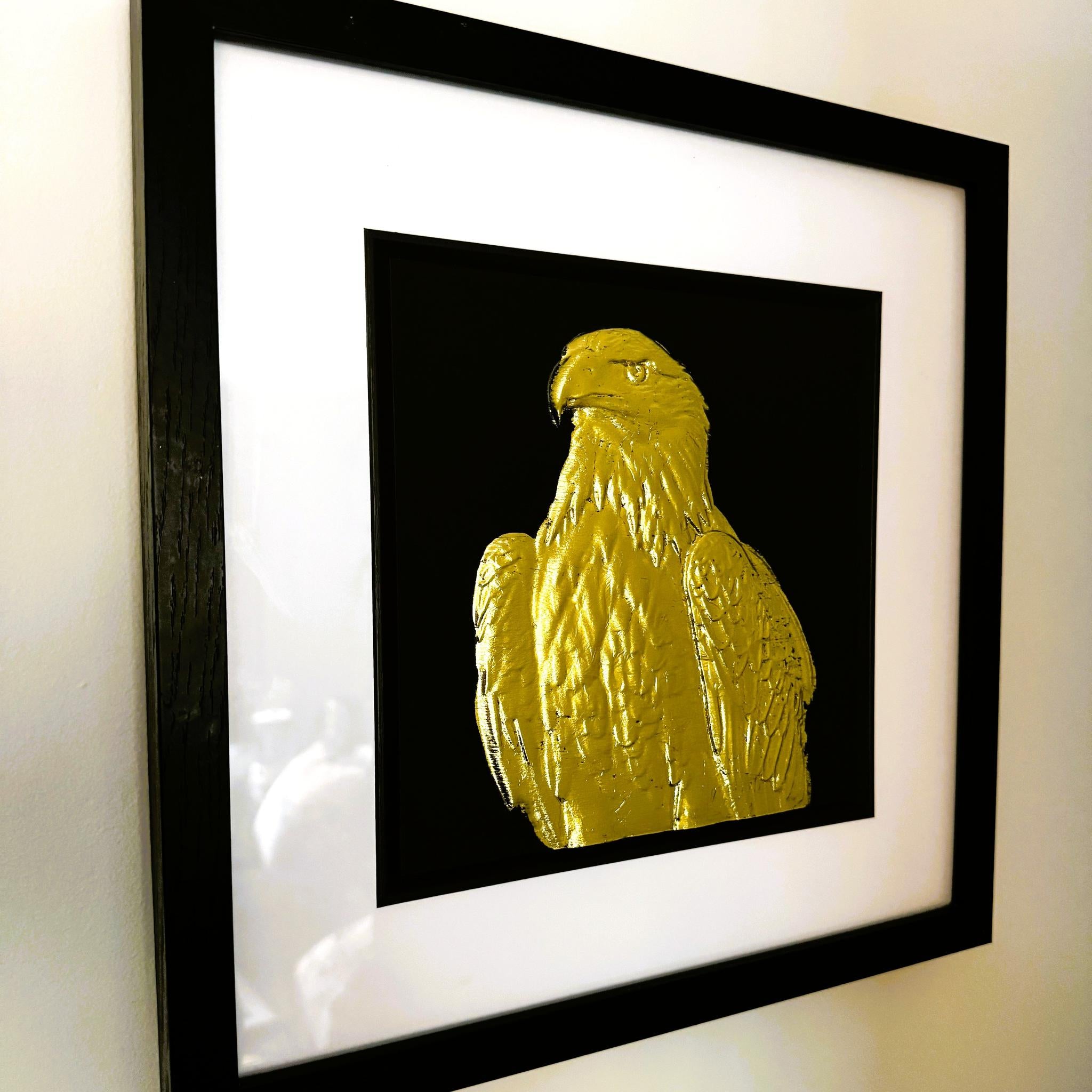 Angled view of gold leaf eagle wall art showing frame depth and surface detail