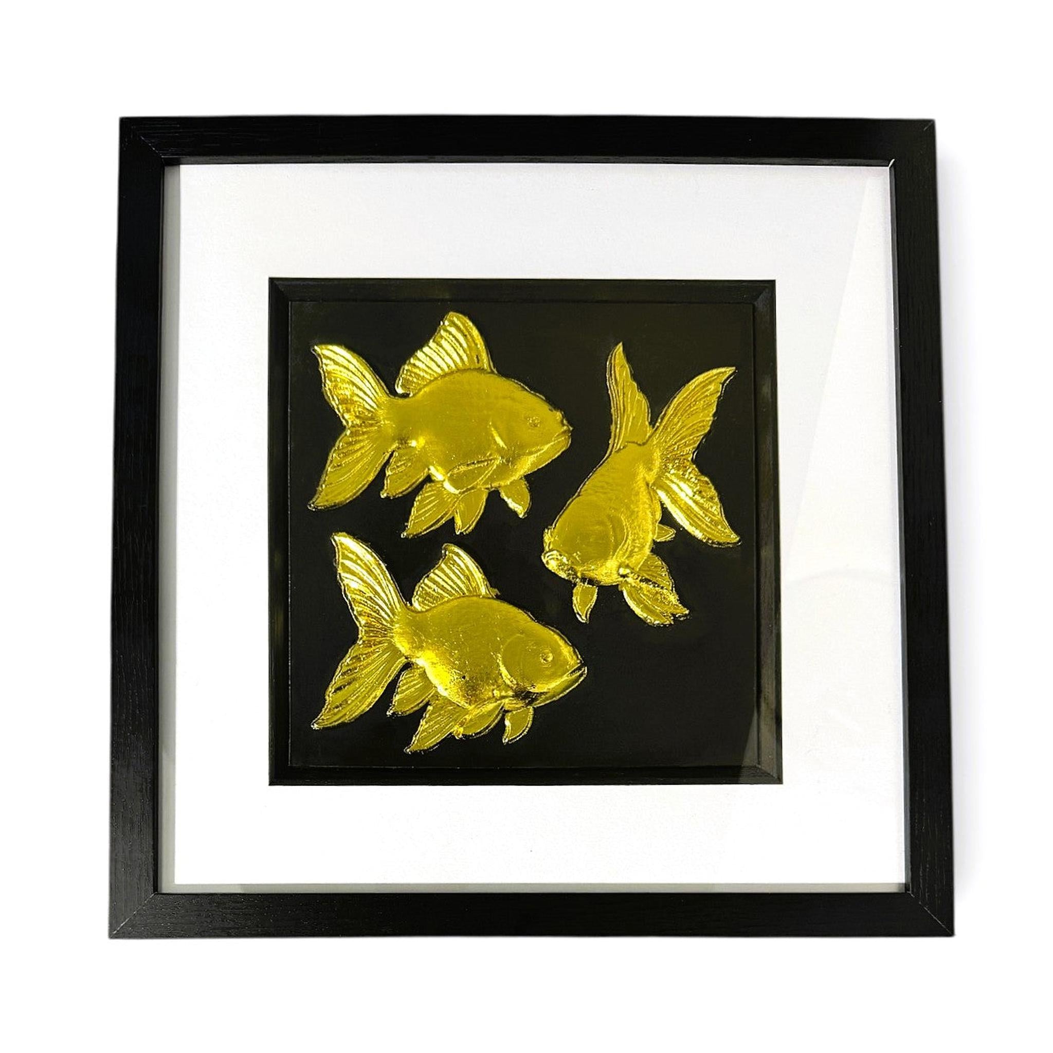 Front-facing gold leaf goldfish wall art with black background and white mount