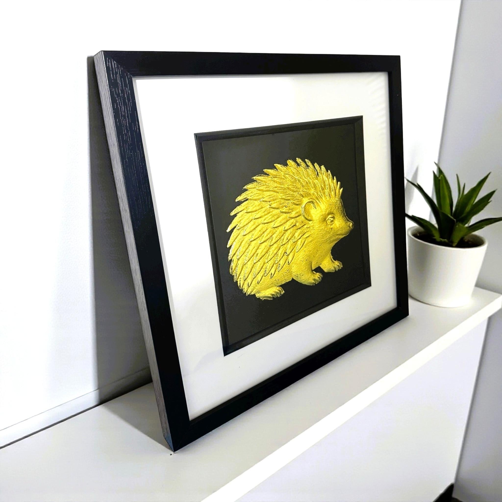 Angled side view of hedgehog framed wall art showing frame depth and finish