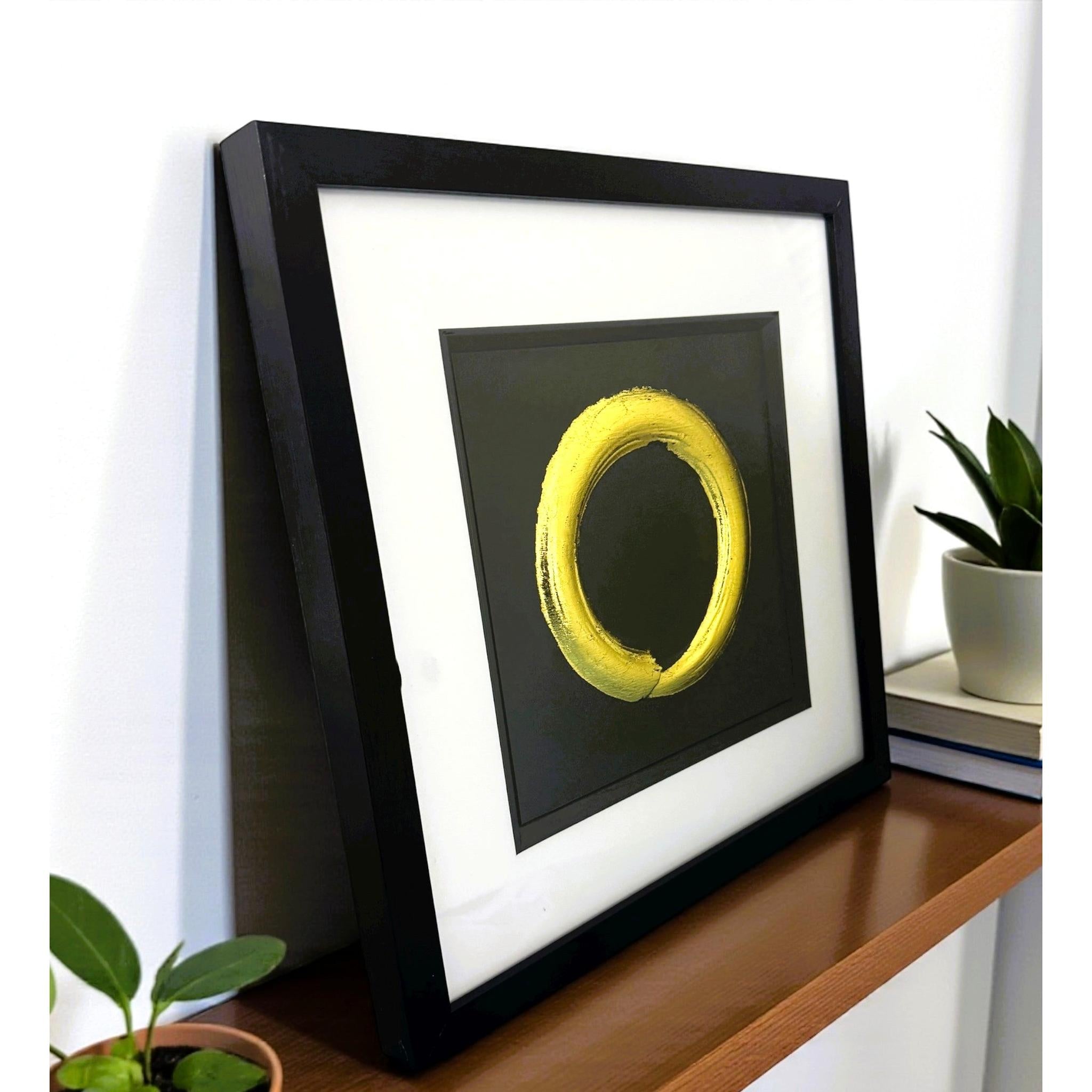 Angled view of Japandi Enso Circle wall art on a wooden surface