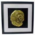 Lhasa Apso framed wall art in gold leaf with black wooden frame and white mount shown at an angled view