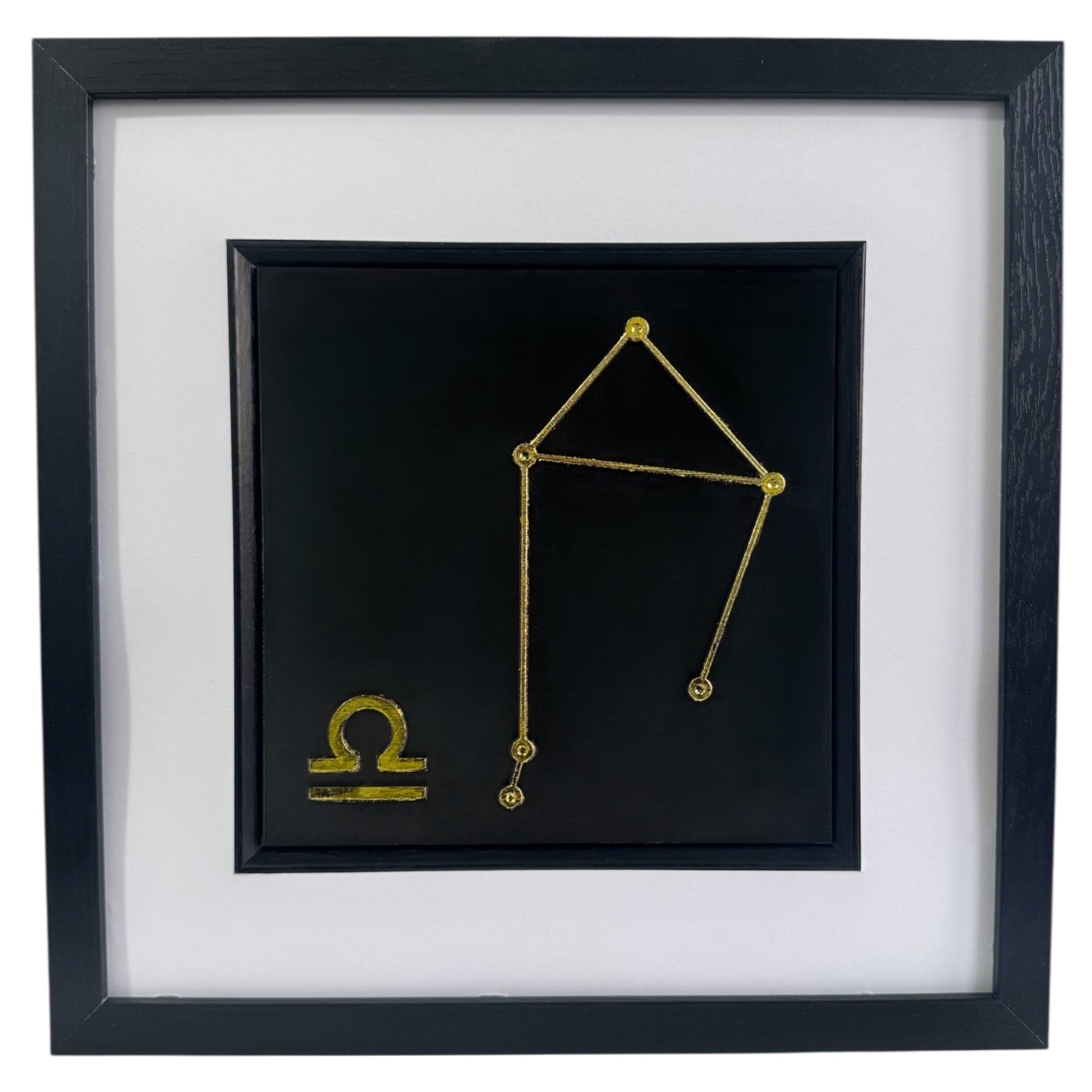Gold Libra constellation wall art framed in black with white mount, raised relief Libra zodiac constellation on a black background