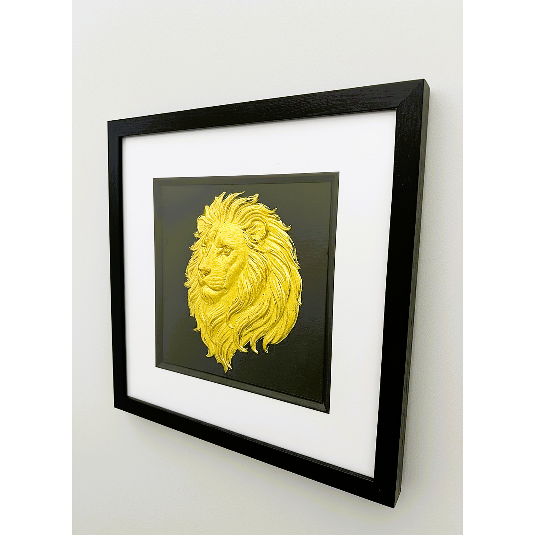 Framed gold lion wall art shown from an angled wall view