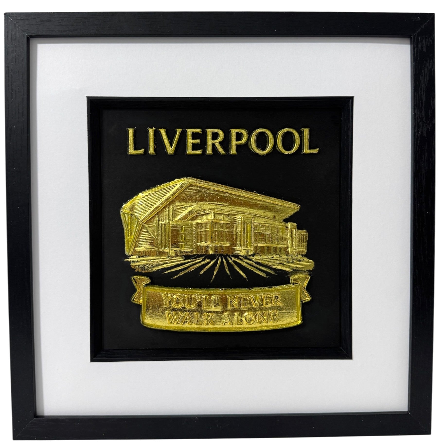 Gold 3D relief wall art of Liverpool Anfield Main Stand featuring You'll Never Walk Alone banner.