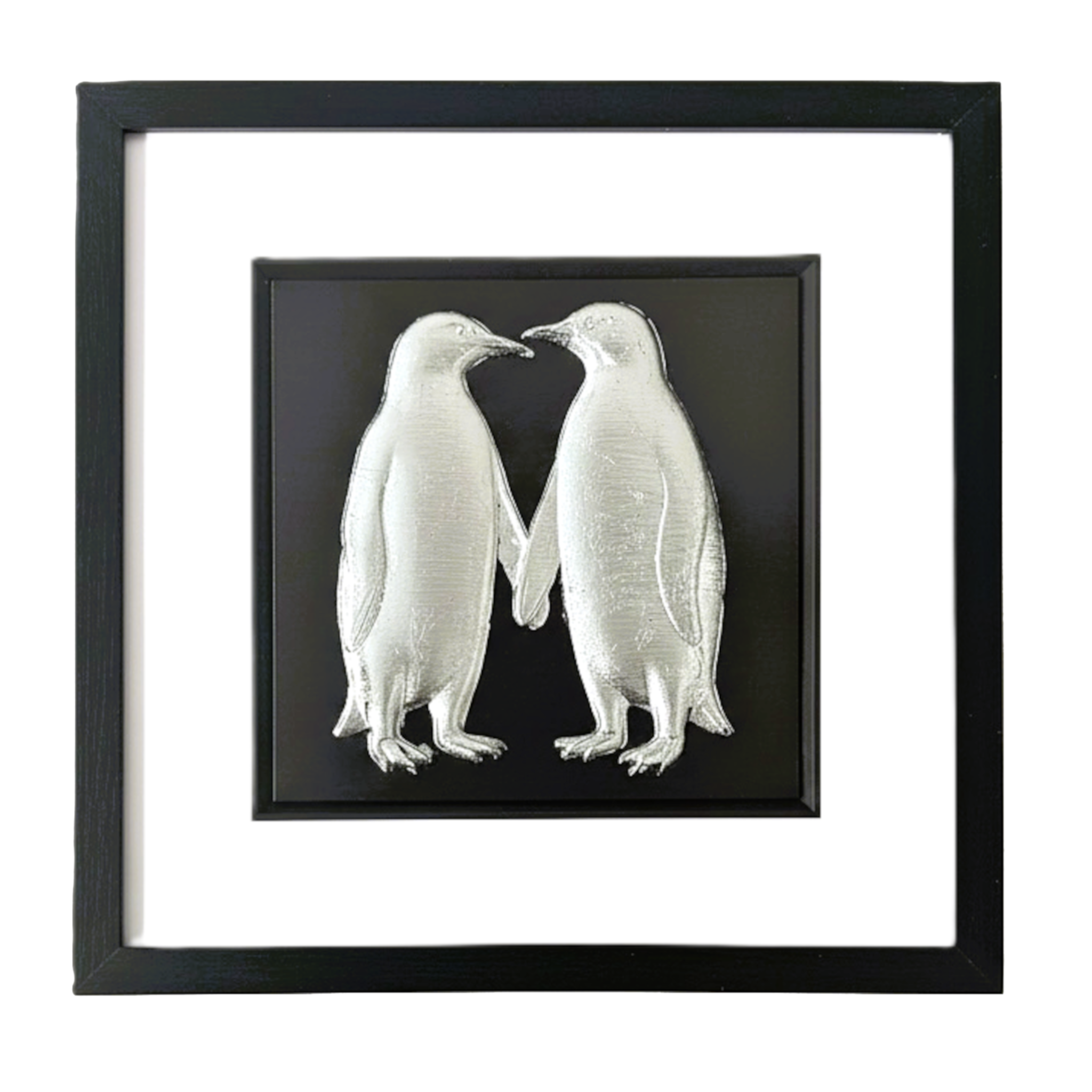Silver penguin couple wall art framed in black with white mount on a white background