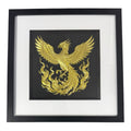Gold phoenix rising wall art framed in black with white mount, raised phoenix wings and flowing flames on a black background