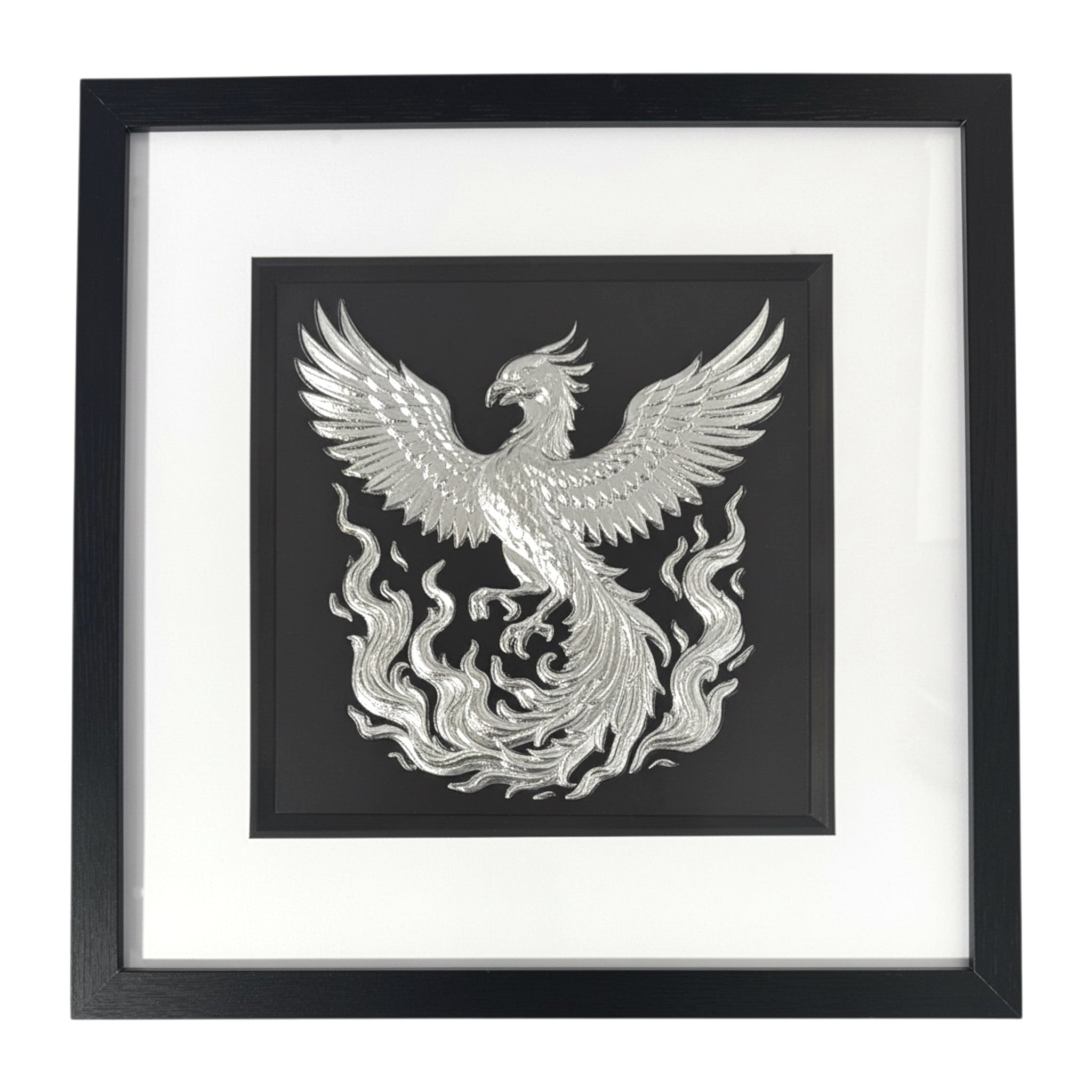 Silver phoenix rising wall art framed in black with white mount, raised relief phoenix emerging from flames on a black background