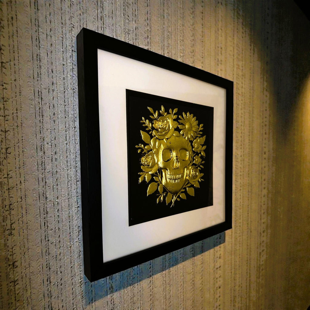 Angled view of floral skull wall art showing depth and frame detail