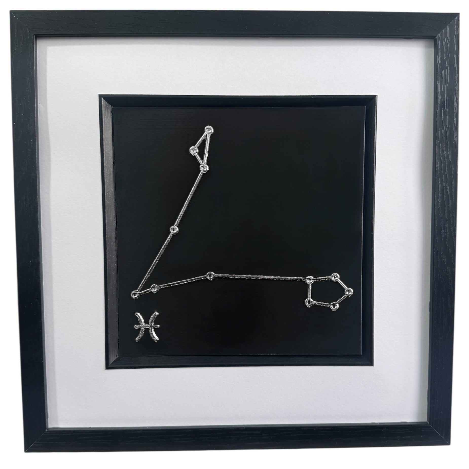 Silver leaf Pisces constellation 3d wall art on black background with white mount
