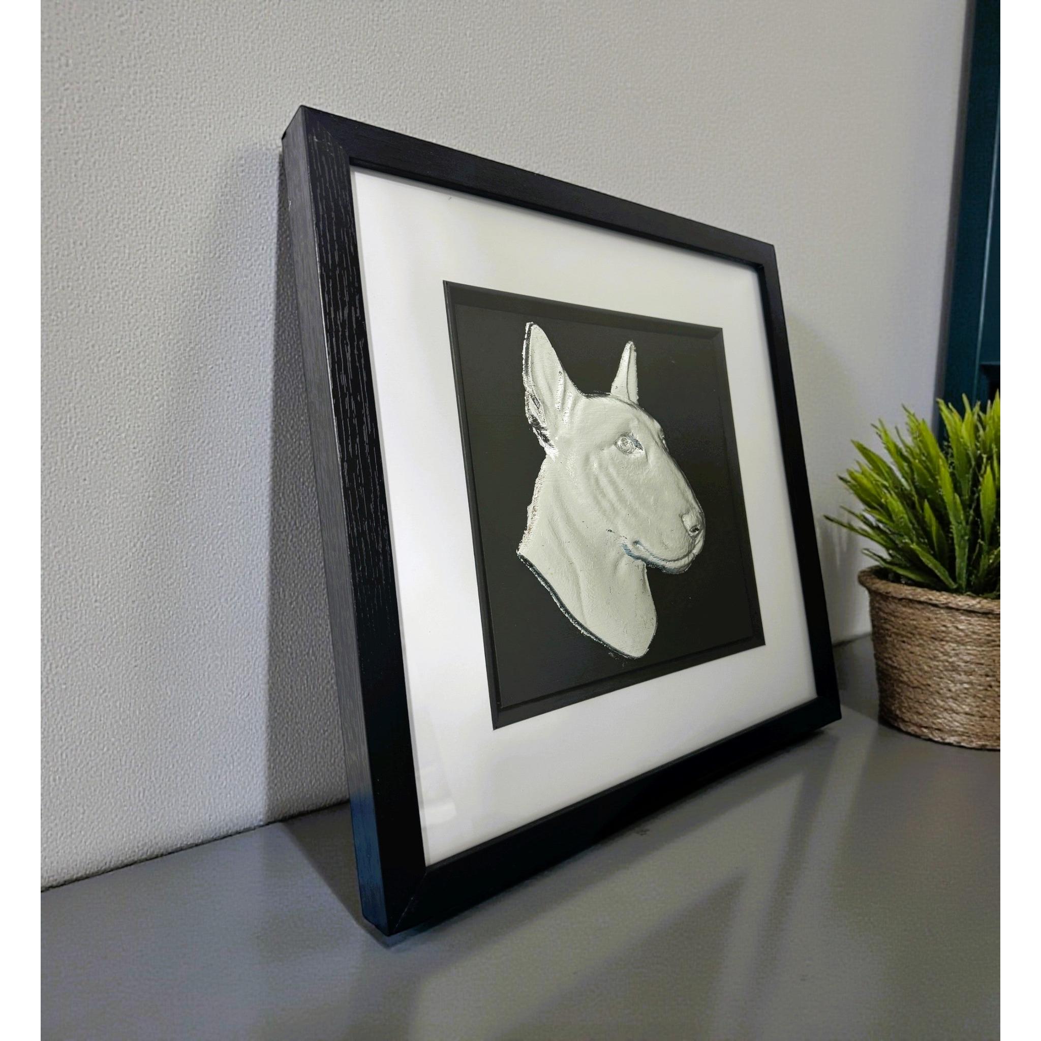English bull terrier dog wall art displayed on a desk in a black frame with gold leaf finish by JP Designs