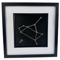 Silver Sagittarius constellation wall art on black background with white mount