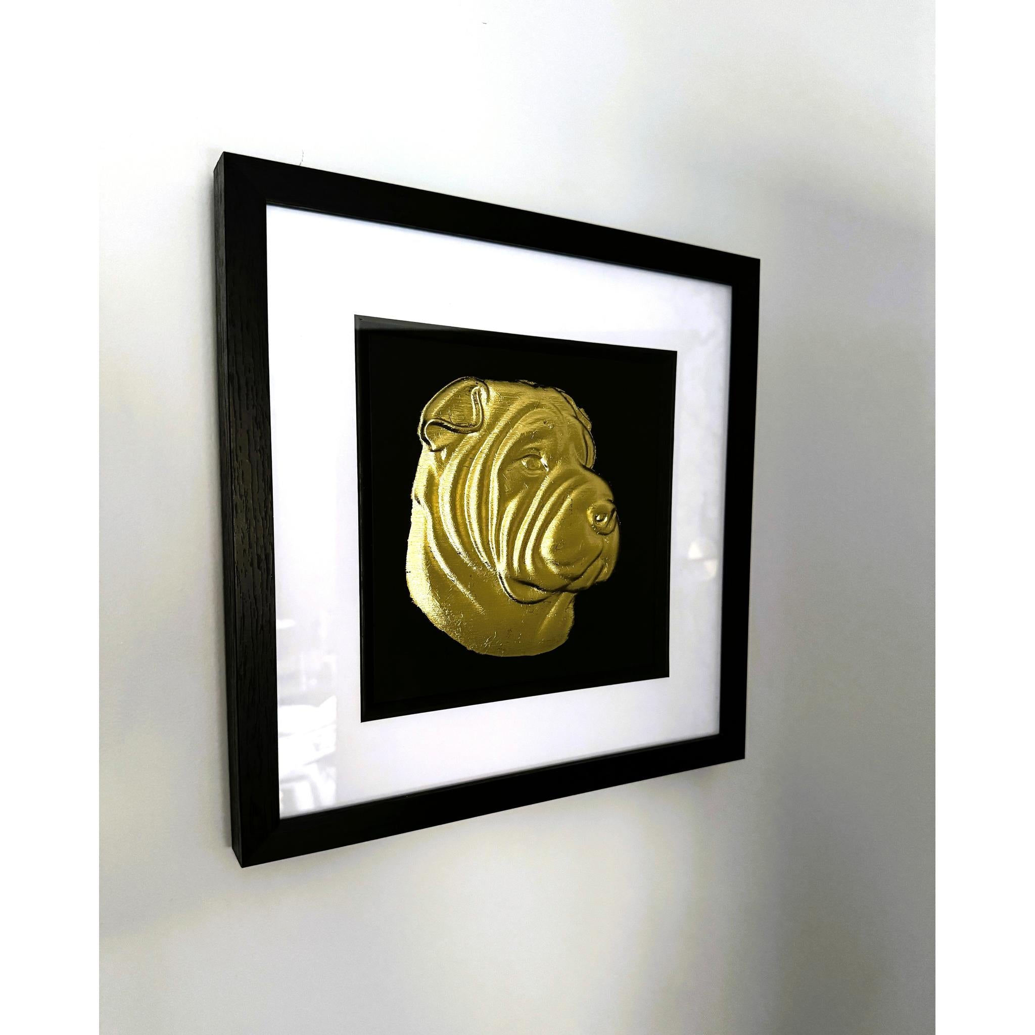 Shar Pei framed wall art in gold leaf shown mounted on a wall at a slight angle with black wooden frame and white mount