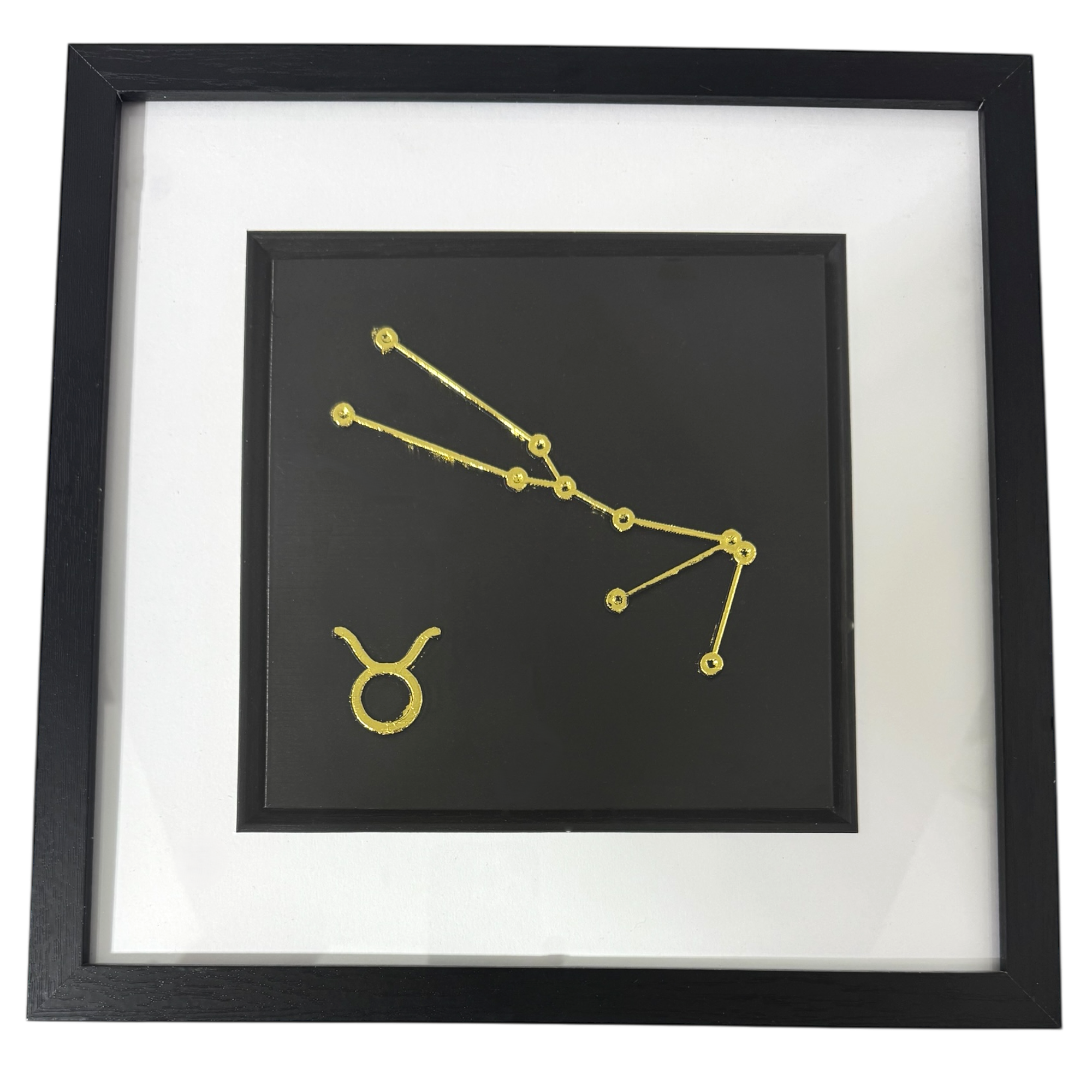 Gold Taurus constellation wall art on black background with white mount