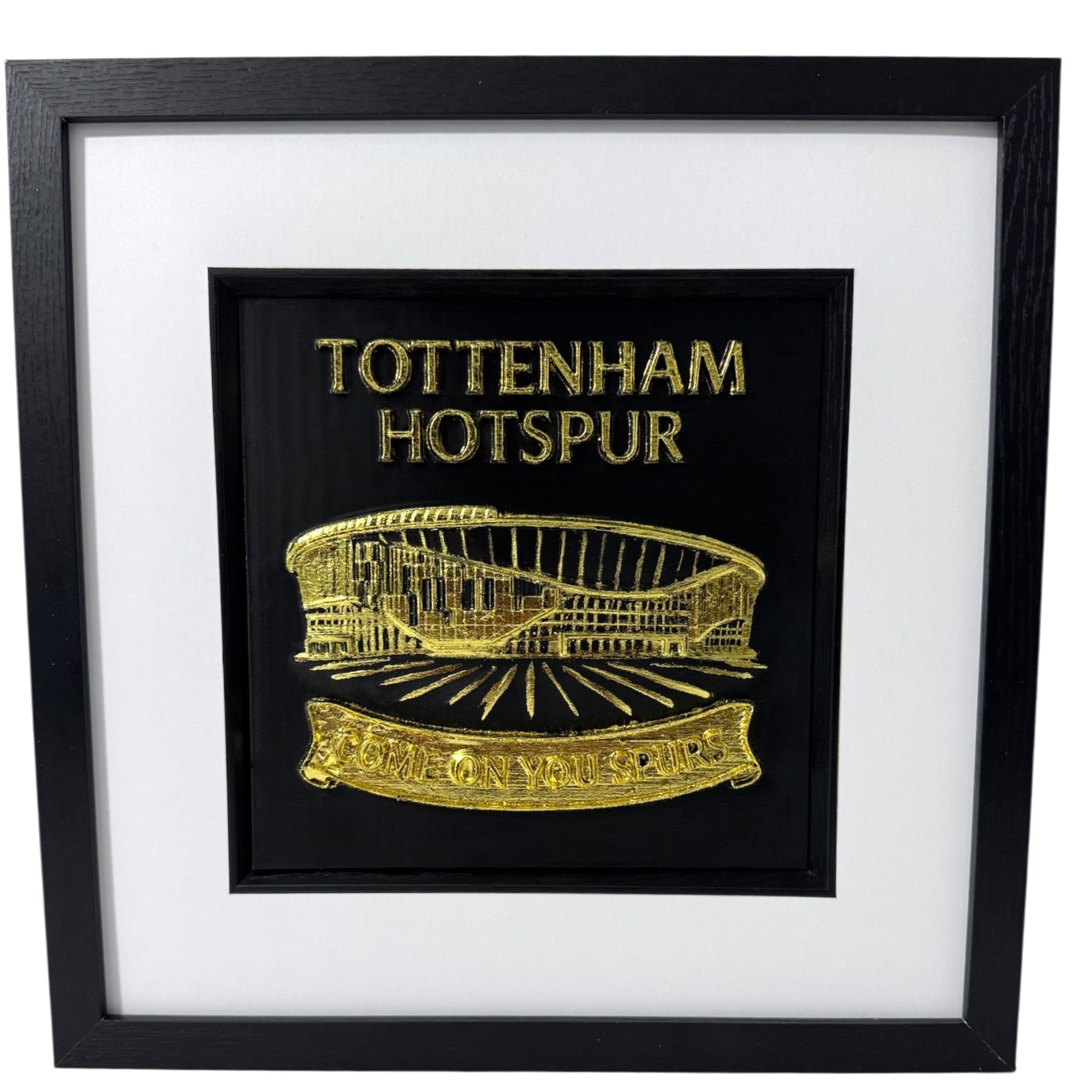 Front view Tottenham Hotspur stadium wall art in gold leaf, raised 3D relief on black background with stadium illustration and bold lettering