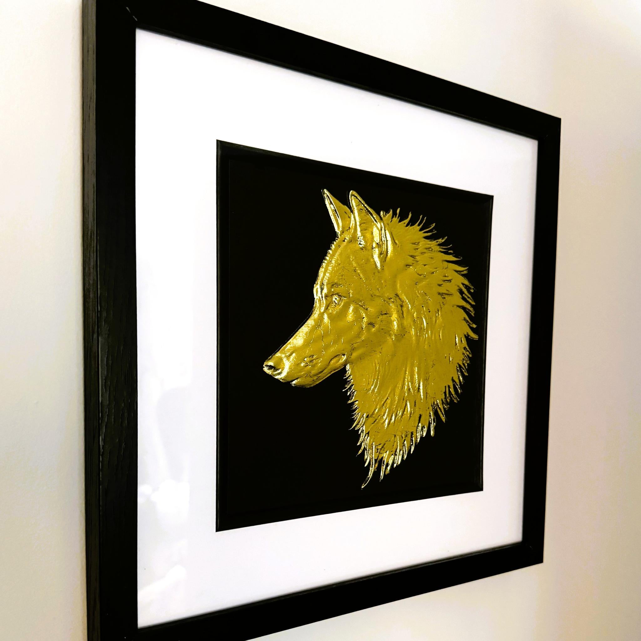 Gold wolf head wall art shown from an angled wall view