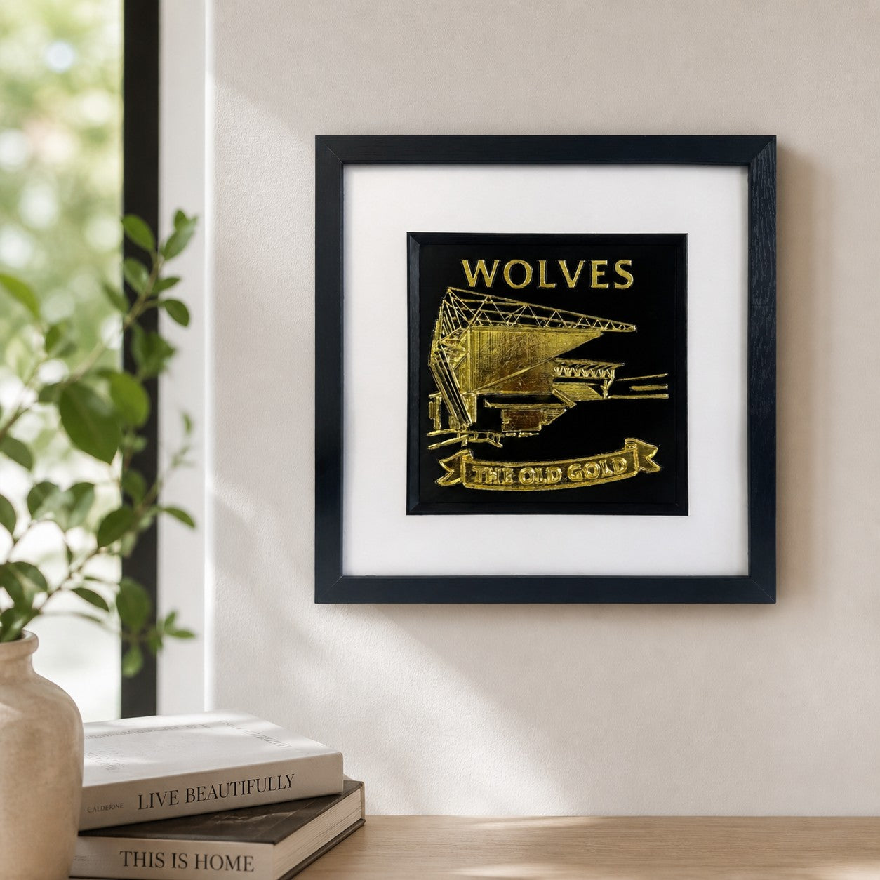 Lifestyle photo of Wolves wall art displayed on a neutral wall above a wooden surface with home decor.
