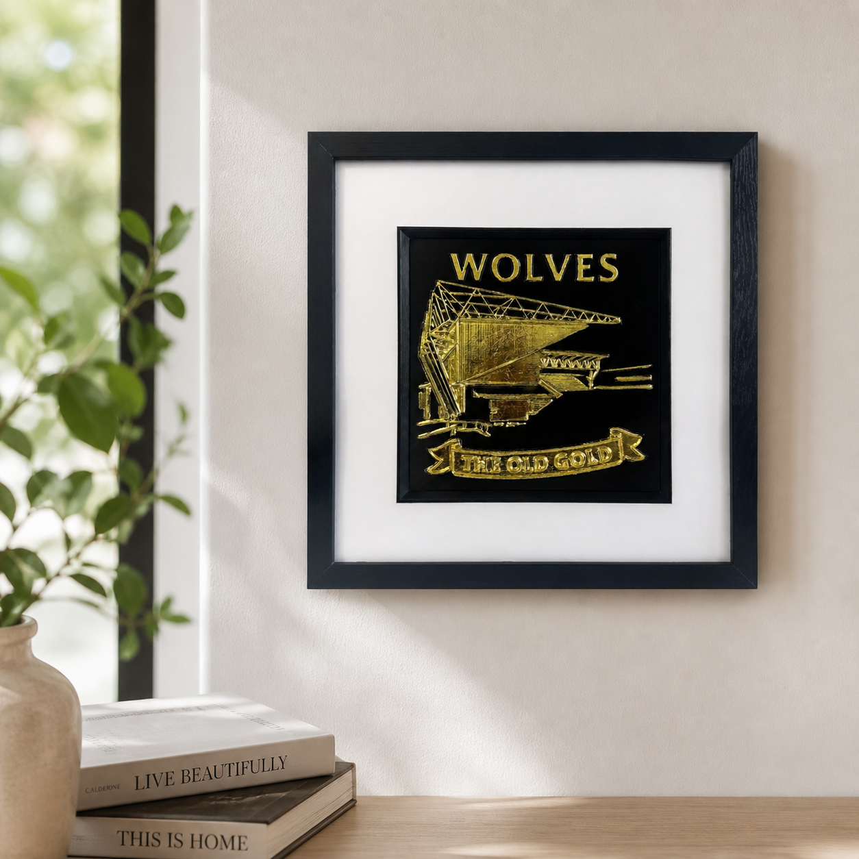 Lifestyle photo of Wolves wall art displayed on a neutral wall above a wooden surface with home decor.