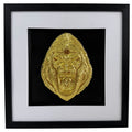 Straight-on gorilla artwork in Gold finish, raised gorilla face relief, black central backing, black inner surround, wide white mount and black square box frame.