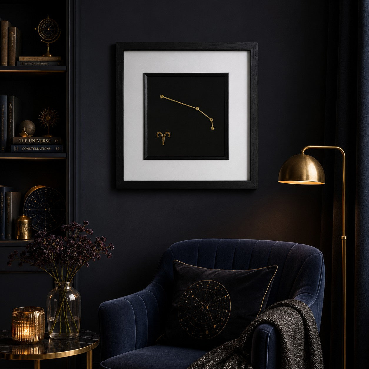 Aries zodiac constellation framed wall art in gold displayed on a dark wall with celestial decor, velvet chair, warm lighting and gold accents.
